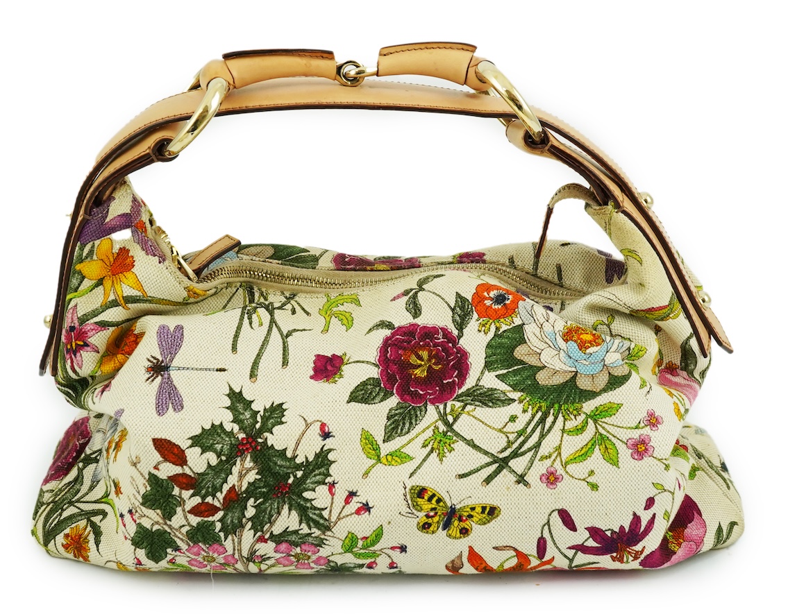 A Gucci flora canvas horse-bit hobo bag with dust bag